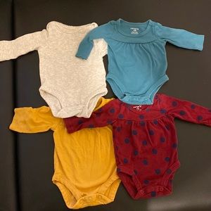 4 pack carters NB long sleeved onesies
